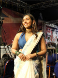 Saree paired with a Halter-neck Blouse